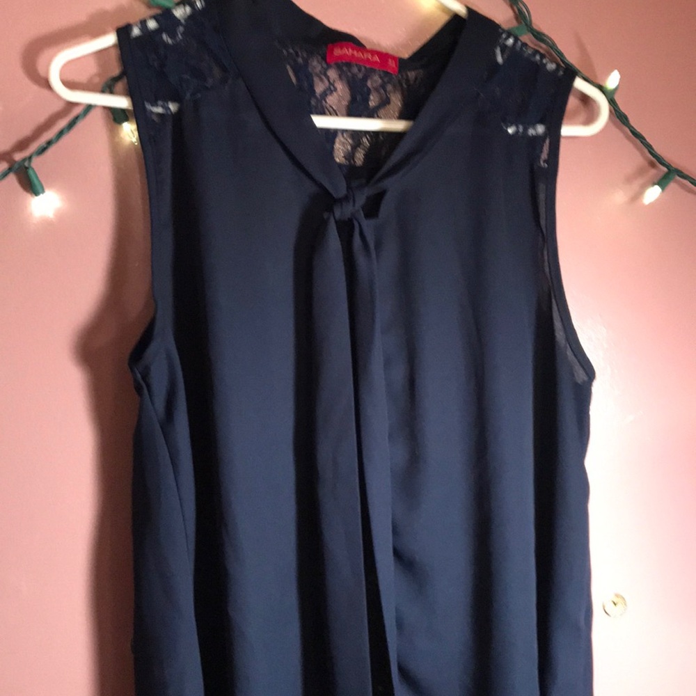 A no sleeve blouse that is royal blue